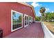 Spacious deck with large windows overlooking waterfront views and mature trees at 2400 N Griffin Dr, Leesburg, FL 34748