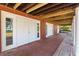 Exterior view with a brick paver porch and several access doors at 2400 N Griffin Dr, Leesburg, FL 34748