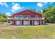 Stately two-story home with expansive yard and elevated outdoor entertaining space at 2400 N Griffin Dr, Leesburg, FL 34748