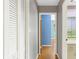 Hallway with closet, doorways and hardwood flooring that provides access to a well-designed floorplan at 2400 N Griffin Dr, Leesburg, FL 34748