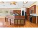 Well-appointed kitchen with center island, custom cabinetry, and modern appliances at 2400 N Griffin Dr, Leesburg, FL 34748