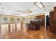 Open floor plan kitchen featuring wood floors, center island, and bright lighting at 2400 N Griffin Dr, Leesburg, FL 34748