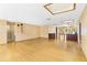 Expansive living room featuring gleaming wood floors, textured walls, and recessed lighting at 2400 N Griffin Dr, Leesburg, FL 34748