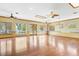 Open living room area with water views, hardwood floors, ceiling fans and natural light at 2400 N Griffin Dr, Leesburg, FL 34748