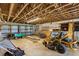 Exposed rafters with storage area containing equipment and shelving at 2400 N Griffin Dr, Leesburg, FL 34748