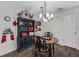 Charming dining area featuring rustic decor, and a black decorative china cabinet at 2450 Kingstree Pl, The Villages, FL 32162