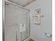 Clean shower with sliding glass doors, white tile surround, and updated fixtures at 2450 Kingstree Pl, The Villages, FL 32162