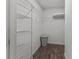 Spacious walk-in closet with wire shelving and a laminate floor at 2450 Kingstree Pl, The Villages, FL 32162