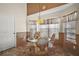 Charming breakfast nook with a glass-top table, wicker chairs, and natural light, perfect for casual dining at 25129 Riverwalk Dr, Leesburg, FL 34748
