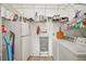 Practical laundry room with washer, dryer, and ample storage, providing convenience and organization at 25129 Riverwalk Dr, Leesburg, FL 34748