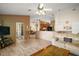 Cozy living room with an open floor plan, seamlessly connecting to the kitchen and dining areas at 25129 Riverwalk Dr, Leesburg, FL 34748