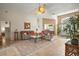 Bright living room boasting a ceiling fan, tile floor, and lots of natural light at 25129 Riverwalk Dr, Leesburg, FL 34748