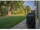 Green backyard with mature trees and patio at 2539 Caithness Way, Clermont, FL 34714