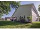 Expansive backyard with healthy lawn and home exterior with screened in porch at 2539 Caithness Way, Clermont, FL 34714