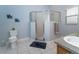Bathroom featuring tiled floor, a glass shower and a single vanity with a white sink at 2539 Caithness Way, Clermont, FL 34714