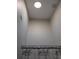 Bathroom featuring a tropical-themed shower curtain, skylight, and neutral walls at 2539 Caithness Way, Clermont, FL 34714
