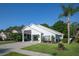 Charming single-story home with a spacious carport and well-manicured lawn with landscaped flower beds at 2539 Caithness Way, Clermont, FL 34714
