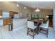 Eat-in kitchen featuring light wood cabinetry, stainless steel appliances, and an open floor plan at 2539 Caithness Way, Clermont, FL 34714