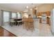 Cozy eat-in kitchen with wood cabinets and appliances, perfect for casual dining at 2539 Caithness Way, Clermont, FL 34714