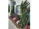Close-up of the landscaping around the home, featuring colorful flowers and lush greenery at 2539 Caithness Way, Clermont, FL 34714