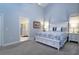 Bright main bedroom boasts high ceilings, a decorative ceiling fan, and an ensuite bathroom at 2539 Caithness Way, Clermont, FL 34714