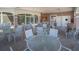 The outdoor patio offers tables and chairs with an adjacent bar and cooking area, creating an ideal entertainment space at 2539 Caithness Way, Clermont, FL 34714