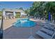 Inviting community pool with comfortable lounge chairs and umbrellas for a relaxing outdoor experience at 2539 Caithness Way, Clermont, FL 34714