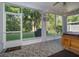 Screened in lanai with tile flooring and views of the backyard, ideal for outdoor living at 2539 Caithness Way, Clermont, FL 34714