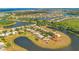Extensive aerial view of a planned community by the lake and forest at 2641 Meadow View Ct, Kissimmee, FL 34746