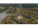 Overhead view of property highlighting its location relative to lake and surrounding community at 2641 Meadow View Ct, Kissimmee, FL 34746