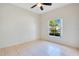 Bright bedroom featuring neutral colors and natural light streaming in through the window at 2641 Meadow View Ct, Kissimmee, FL 34746