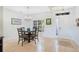 Cozy dining area with a chandelier and a large window for natural light at 2641 Meadow View Ct, Kissimmee, FL 34746