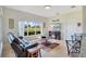 Comfortable living room with large window, fireplace, and tile flooring at 2641 Meadow View Ct, Kissimmee, FL 34746