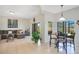 Inviting living space with tile floors, a comfy sectional, and access to the outdoor patio at 2641 Meadow View Ct, Kissimmee, FL 34746