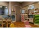 Inviting playroom with seating and toys, featuring a neutral color palette and hardwood floors at 2641 Meadow View Ct, Kissimmee, FL 34746