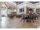 Spacious restaurant with tiled flooring, large screen TVs, tables, and chairs at 2641 Meadow View Ct, Kissimmee, FL 34746