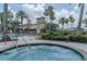 Inviting pool and spa area with a water slide and plenty of seating at 2641 Meadow View Ct, Kissimmee, FL 34746