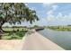 Scenic boardwalk path alongside the water, perfect for leisurely strolls and enjoying nature at 2641 Meadow View Ct, Kissimmee, FL 34746