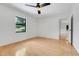 Bedroom showcasing wood floors, a ceiling fan, a large window, and ample natural light at 274 W Kings Hwy, Center Hill, FL 33514
