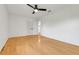 A spacious bedroom with wood floors and a ceiling fan, offering plenty of natural light at 274 W Kings Hwy, Center Hill, FL 33514