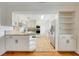Modern kitchen features white cabinets, granite countertops, stainless steel appliances, and tile flooring at 274 W Kings Hwy, Center Hill, FL 33514
