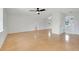 Spacious living room with ceiling fan, hardwood floors, and neutral paint at 274 W Kings Hwy, Center Hill, FL 33514