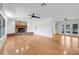 Spacious living area with a brick fireplace, hardwood floors, and a bright, open atmosphere at 274 W Kings Hwy, Center Hill, FL 33514