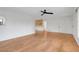 Spacious living room showcasing light hardwood flooring, neutral paint, and natural light at 274 W Kings Hwy, Center Hill, FL 33514