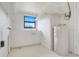Utility room featuring a large sink, water heater, and ample natural light at 274 W Kings Hwy, Center Hill, FL 33514