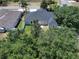 An aerial view shows a home with lush landscaping and a fenced backyard space at 31920 Parkdale Dr, Leesburg, FL 34748