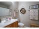 Charming bathroom featuring decorative wall art, modern fixtures, and vanity, creating a serene and stylish retreat at 31920 Parkdale Dr, Leesburg, FL 34748