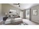 Beautifully staged bedroom with a ceiling fan, natural light, and ample space for relaxation at 31920 Parkdale Dr, Leesburg, FL 34748