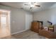 Neutral bedroom featuring carpet, closet, and ceiling fan, offering a versatile space for relaxation and storage at 31920 Parkdale Dr, Leesburg, FL 34748