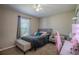 Serene bedroom with a plush bed, bench, and modern decor, perfect for relaxation at 31920 Parkdale Dr, Leesburg, FL 34748
